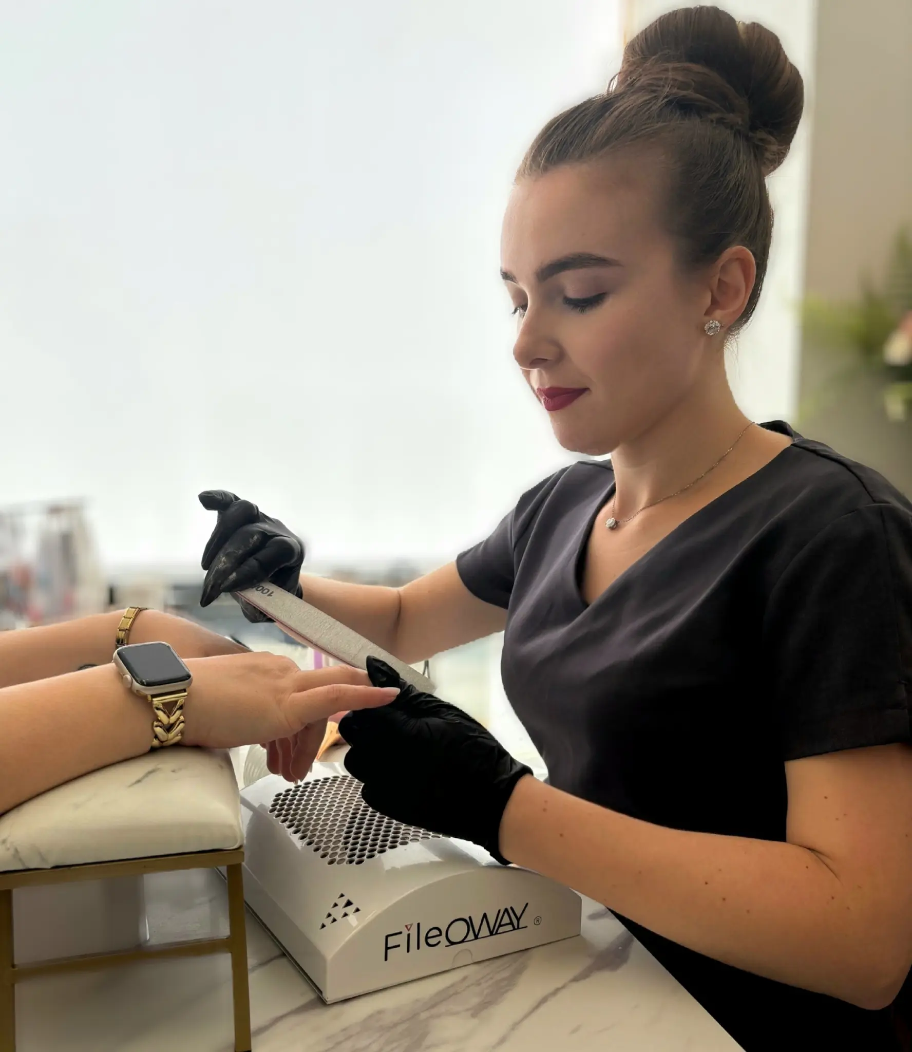 Radina Ignatova, Professional Nail Expert demonstrating e-file cuticle preparation technique in Artistic Touch Academy studio