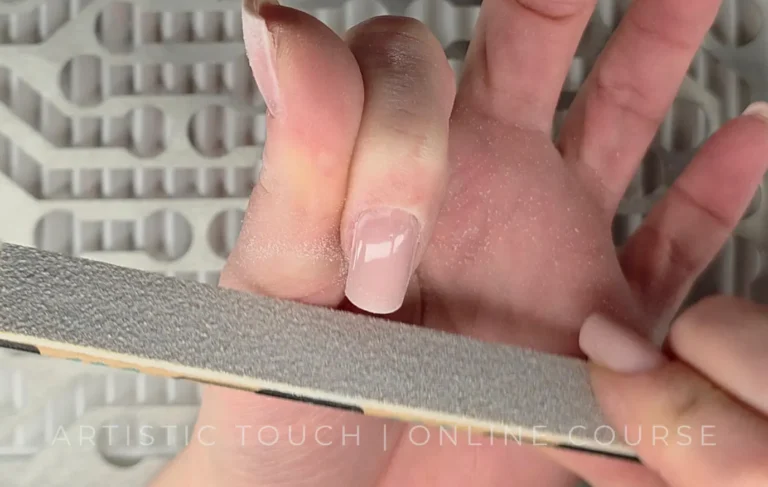 Professional square nail shaping technique using hand file for Cloud Dancer aesthetic showing proper filing method for sharp clean corners