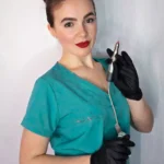 Radina Ignatova professional nail expert and international educator holding e-file nail drill