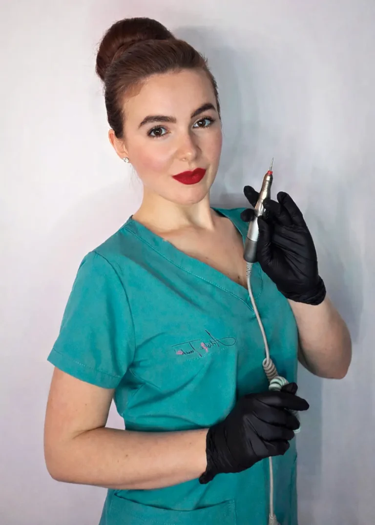 Radina Ignatova professional nail expert and international educator holding e-file nail drill