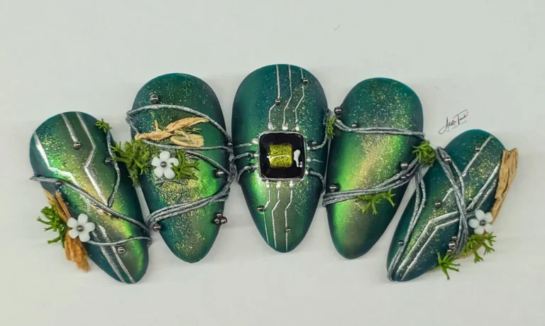Finished editorial nail art set — Nature with a Twist by Radina Ignatova, featuring a computer chip centrepiece, silver gel wires, real moss, dried botanicals and 3D flowers on a chrome green matte base. Scratch Snap competition entry, Scratch magazine 2026.