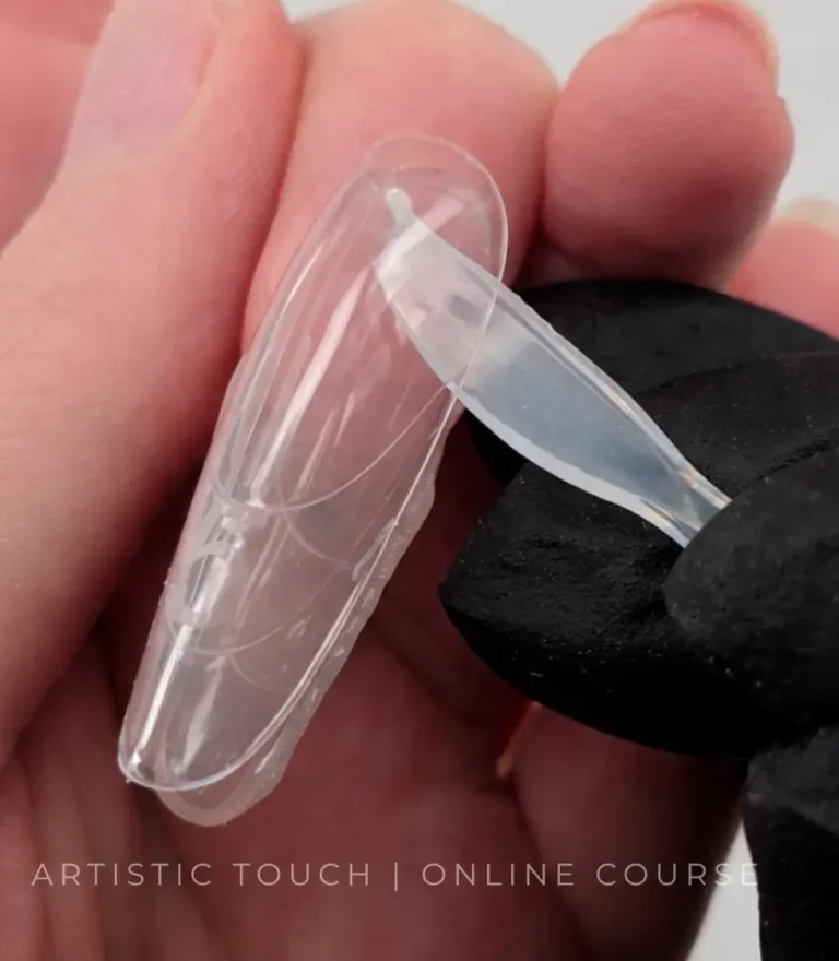 Removing top dual form from almond nail using sandwich dual forms technique in online course