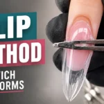 Metal clip holding sandwich dual form on finger showing deceptive secure appearance while invisibly causing apex shifting sidewall thinning and structural imbalance underneath smooth surface