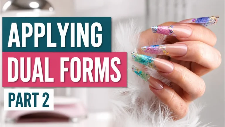 Finished dual form nails showing colourful glitter encapsulation in pink, blue, and green with proper application structure and professional nail shape refinement