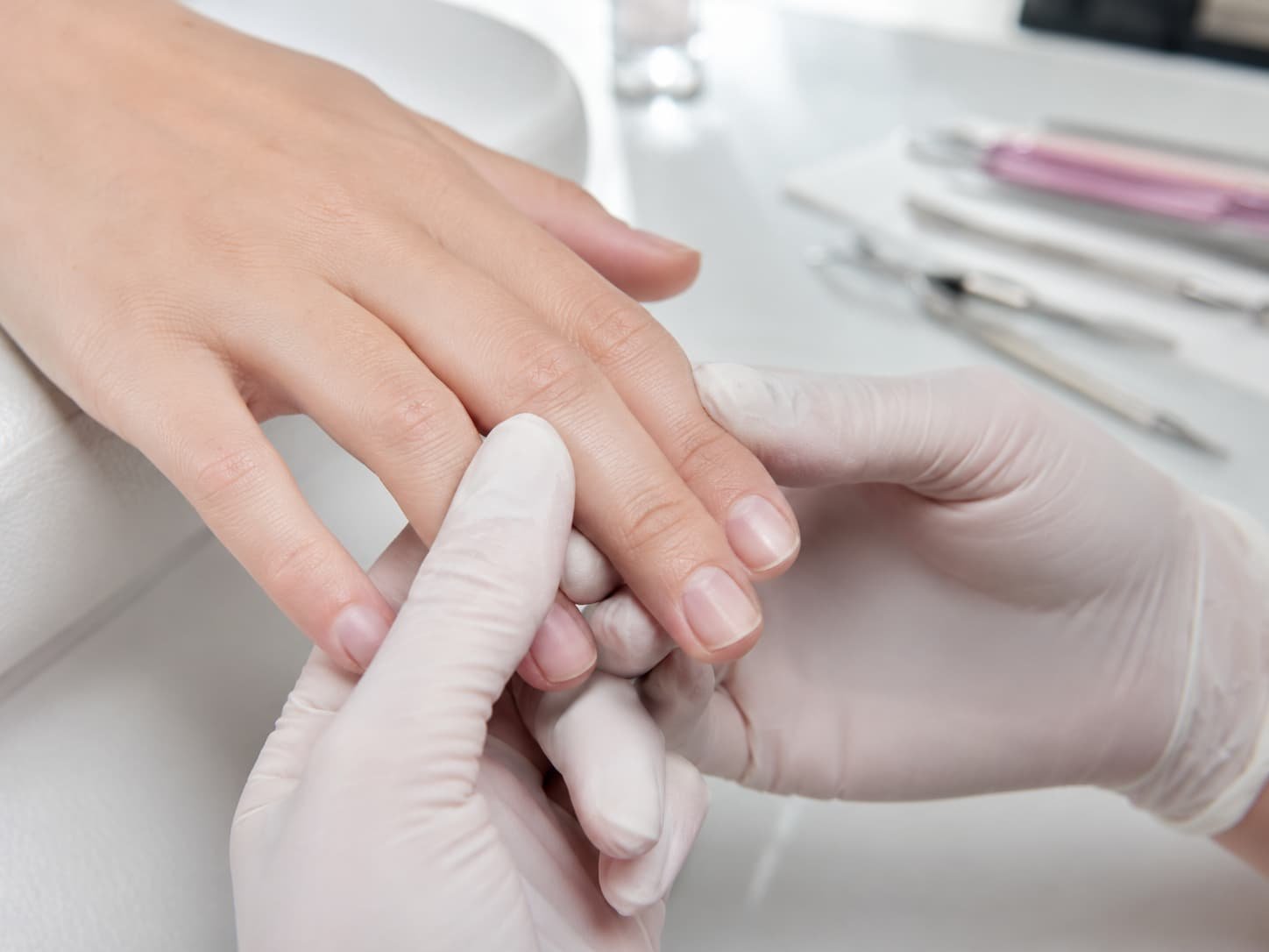 Russian Manicure client nail assessment before service