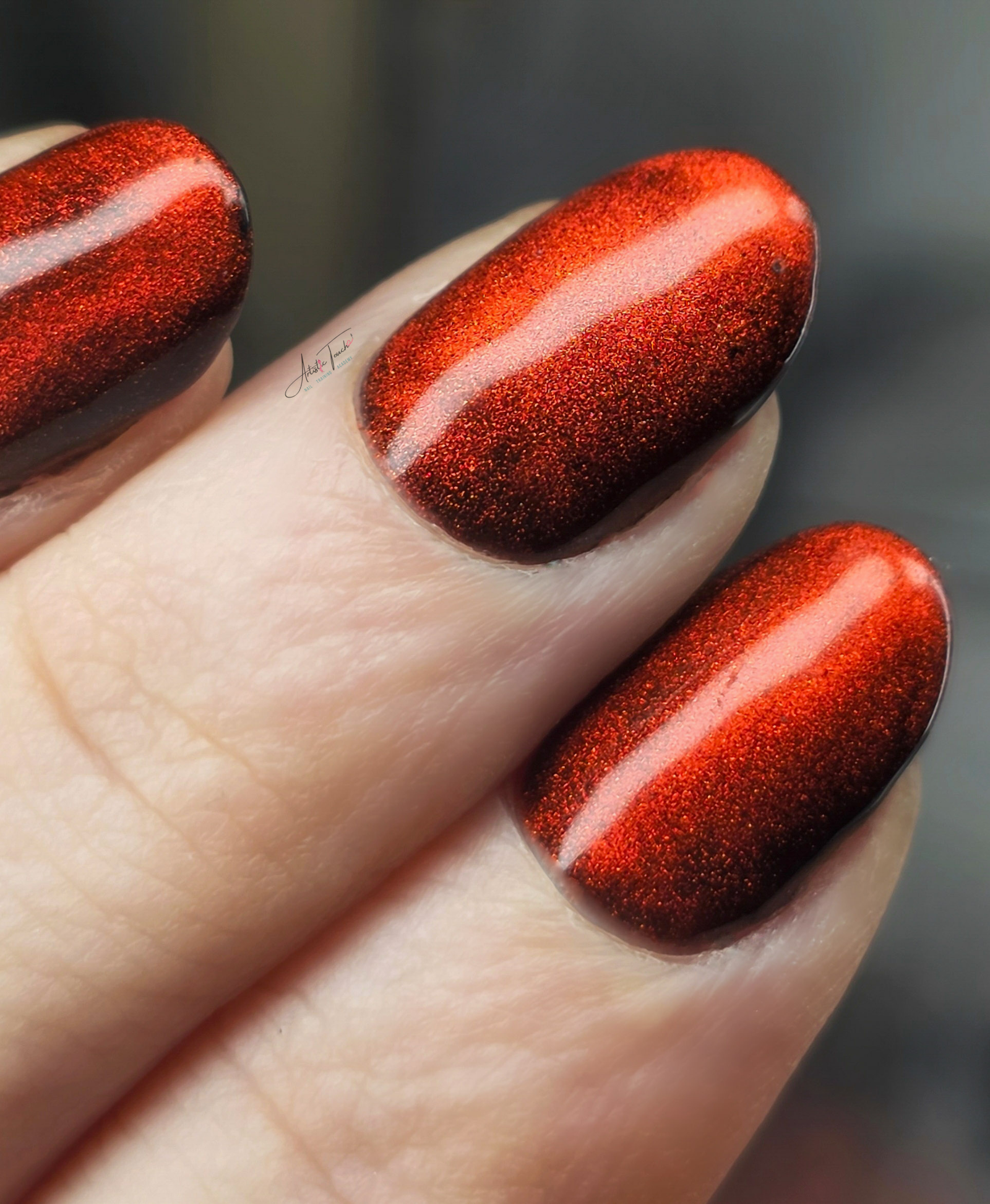 Deep red magnetic cat-eye manicure created by Radina Ignatova